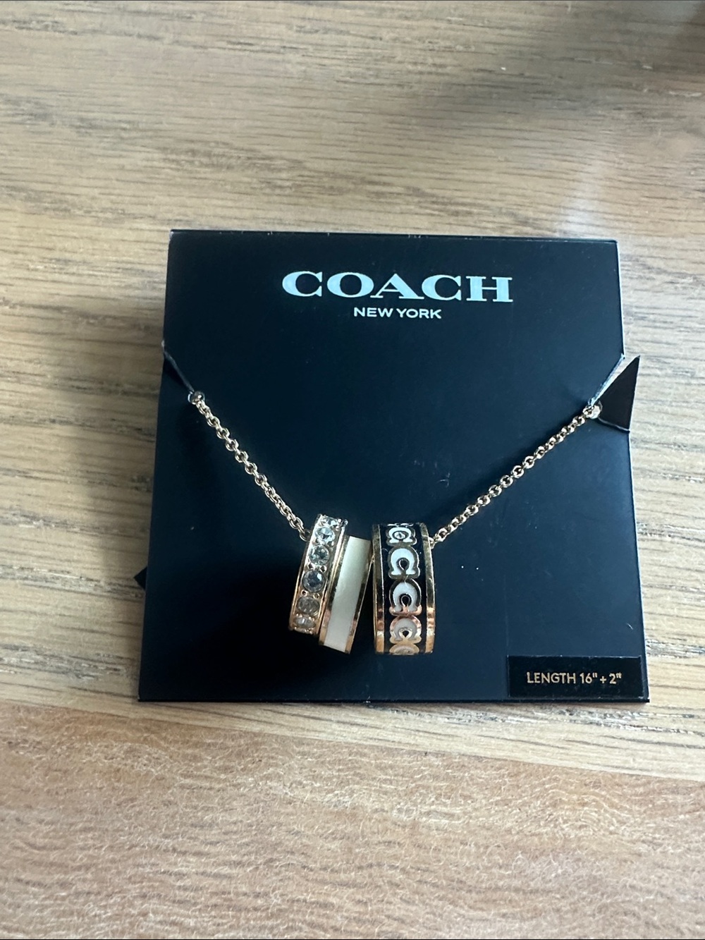 Coach Gold-Tone Triple Ring Pendant Necklace with White Accent